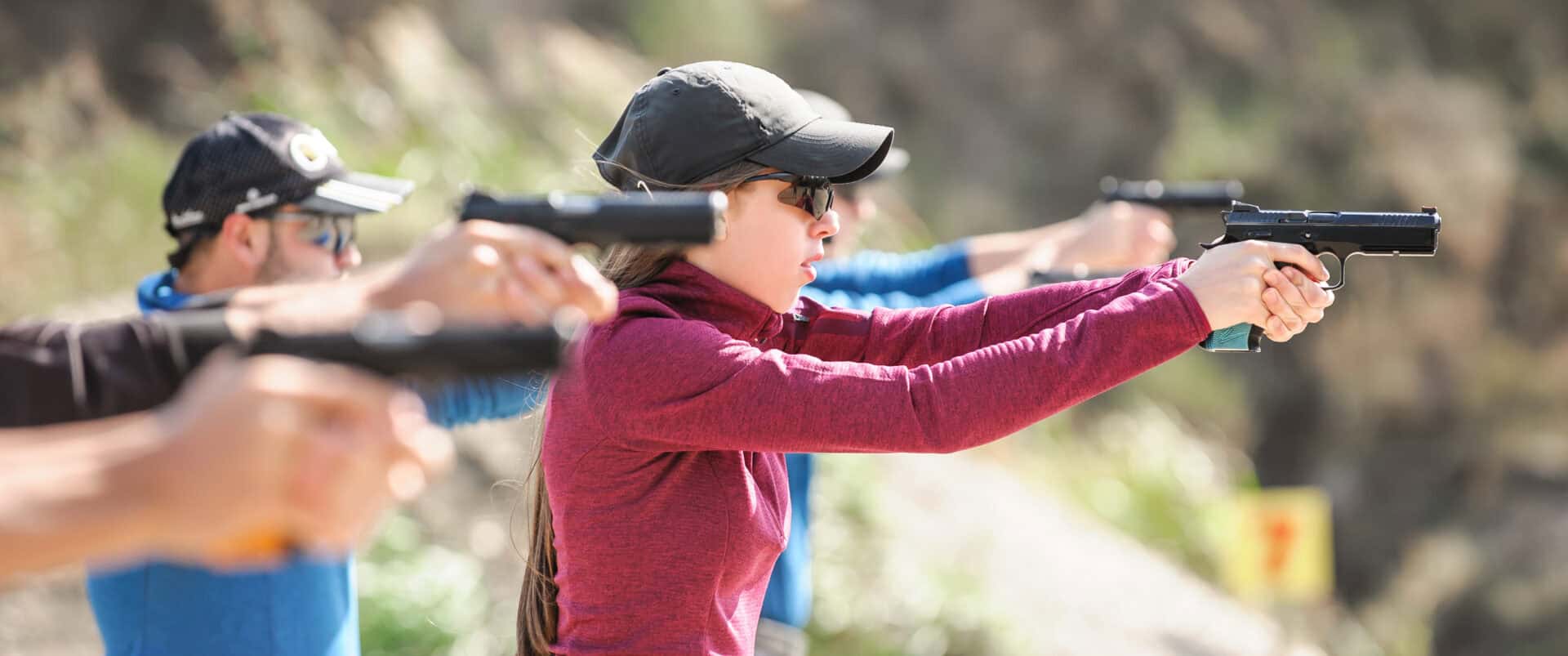 Young people on tactical gun training classes. Shooting and Weapons